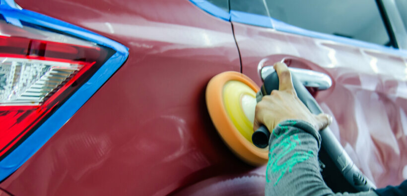 waxing a car with an orbital buffer