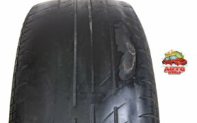 old car tire with unevenly worn tread that is dangerous to drive with