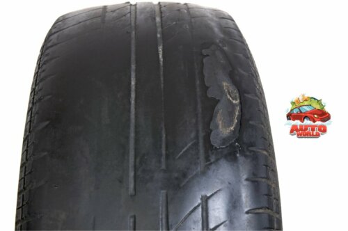 old car tire with unevenly worn tread that is dangerous to drive with