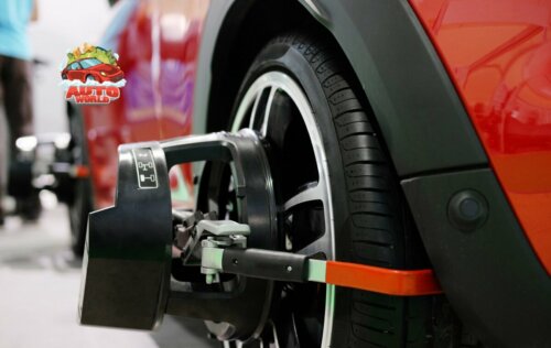 car wheel being aligned at an auto mechanic shop